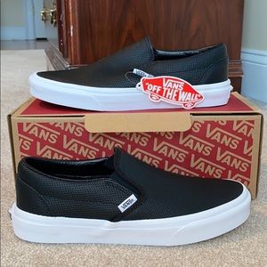 Vans black leather slip ons
